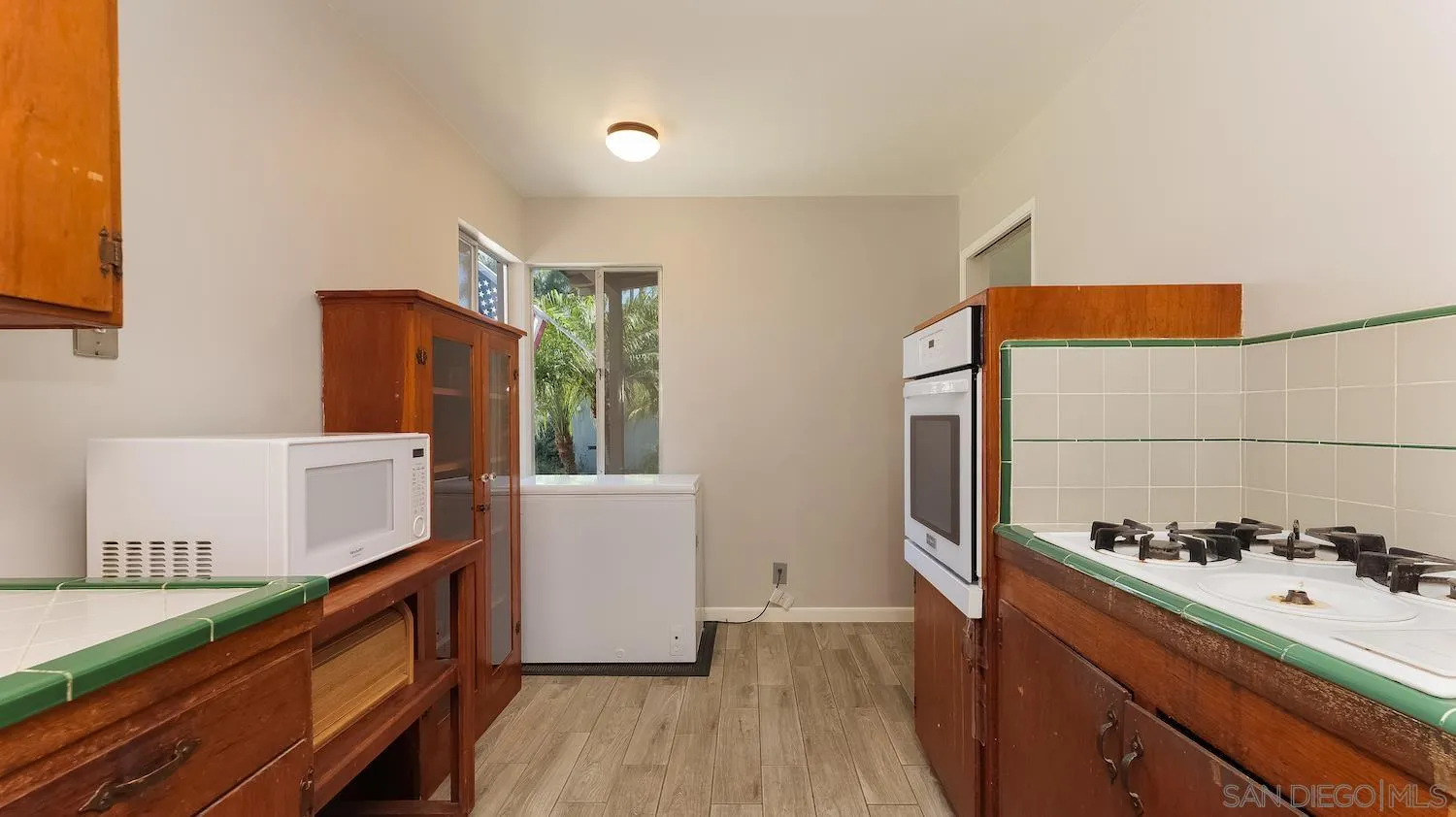 1003 Tiger Tail Road Vista, CA 92084 - Photo 12 of 22 a kitchen with stainless steel appliances a refrigerator and a stove top oven