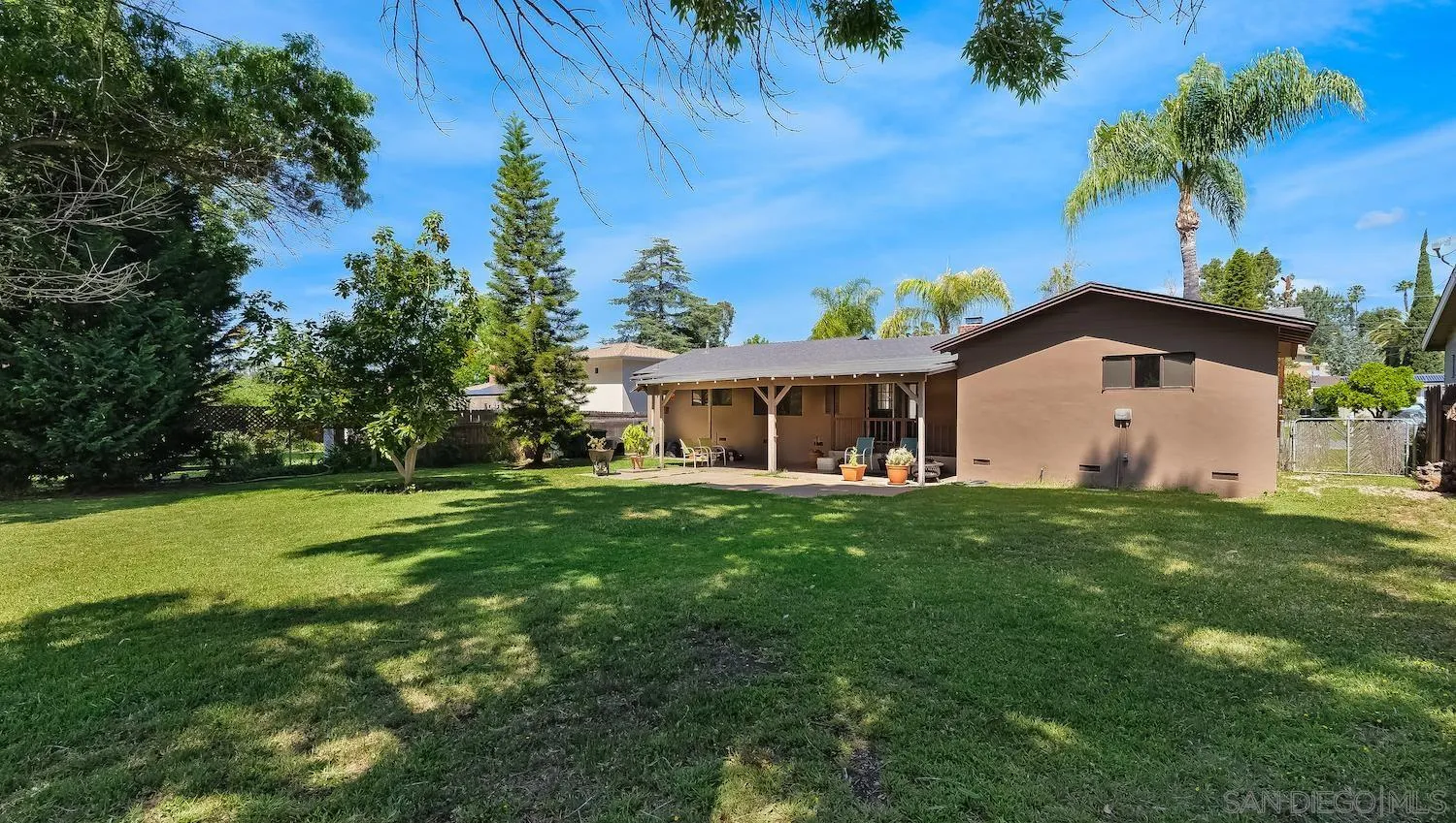 1003 Tiger Tail Road Vista, CA 92084 - Photo 19 of 22 a front view of house with a garden