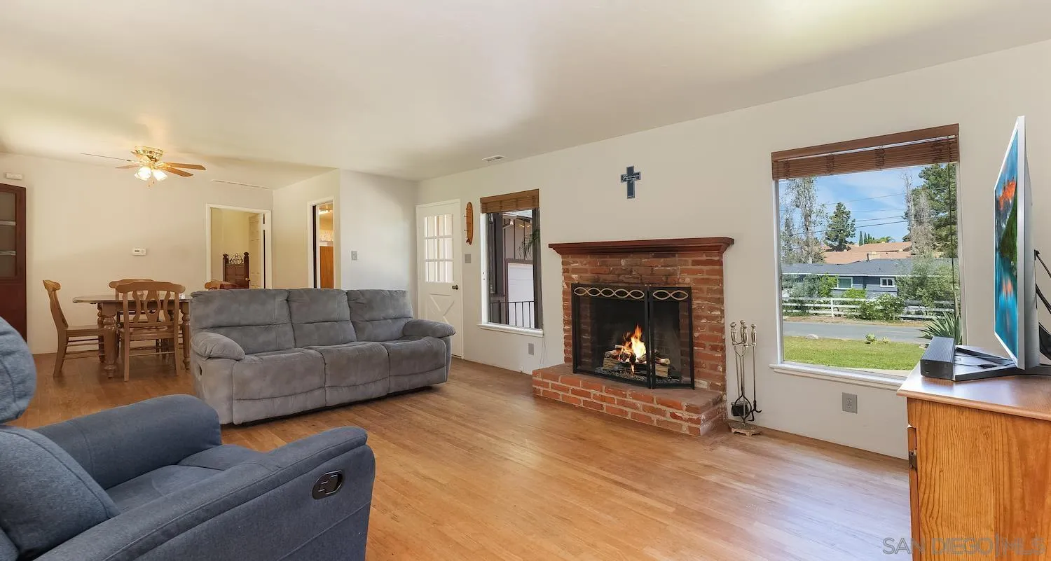 1003 Tiger Tail Road Vista, CA 92084 - Photo 4 of 22 a living room with furniture and a fireplace