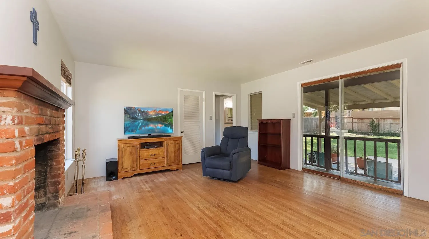 1003 Tiger Tail Road Vista, CA 92084 - Photo 6 of 22 a living room with furniture and a flat screen tv