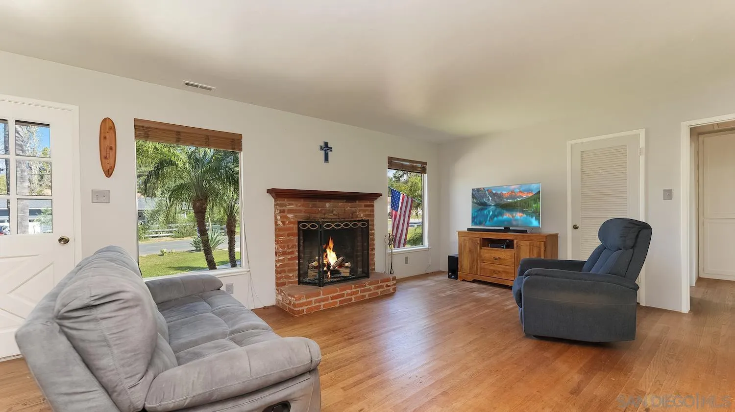 1003 Tiger Tail Road Vista, CA 92084 - Photo 7 of 22 a living room with furniture and a fireplace