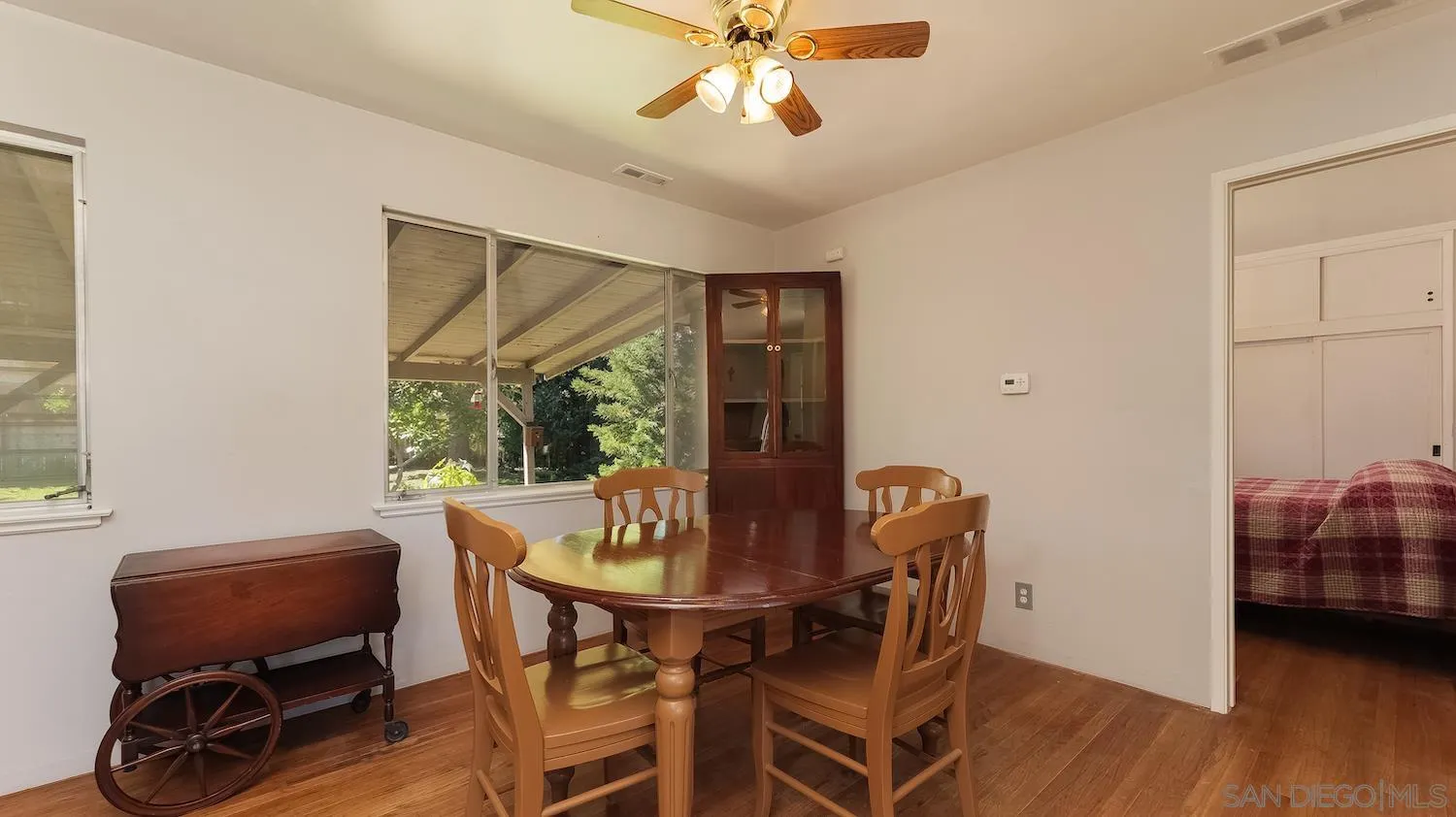 1003 Tiger Tail Road Vista, CA 92084 - Photo 8 of 22 a view of a dining room with furniture and wooden floor