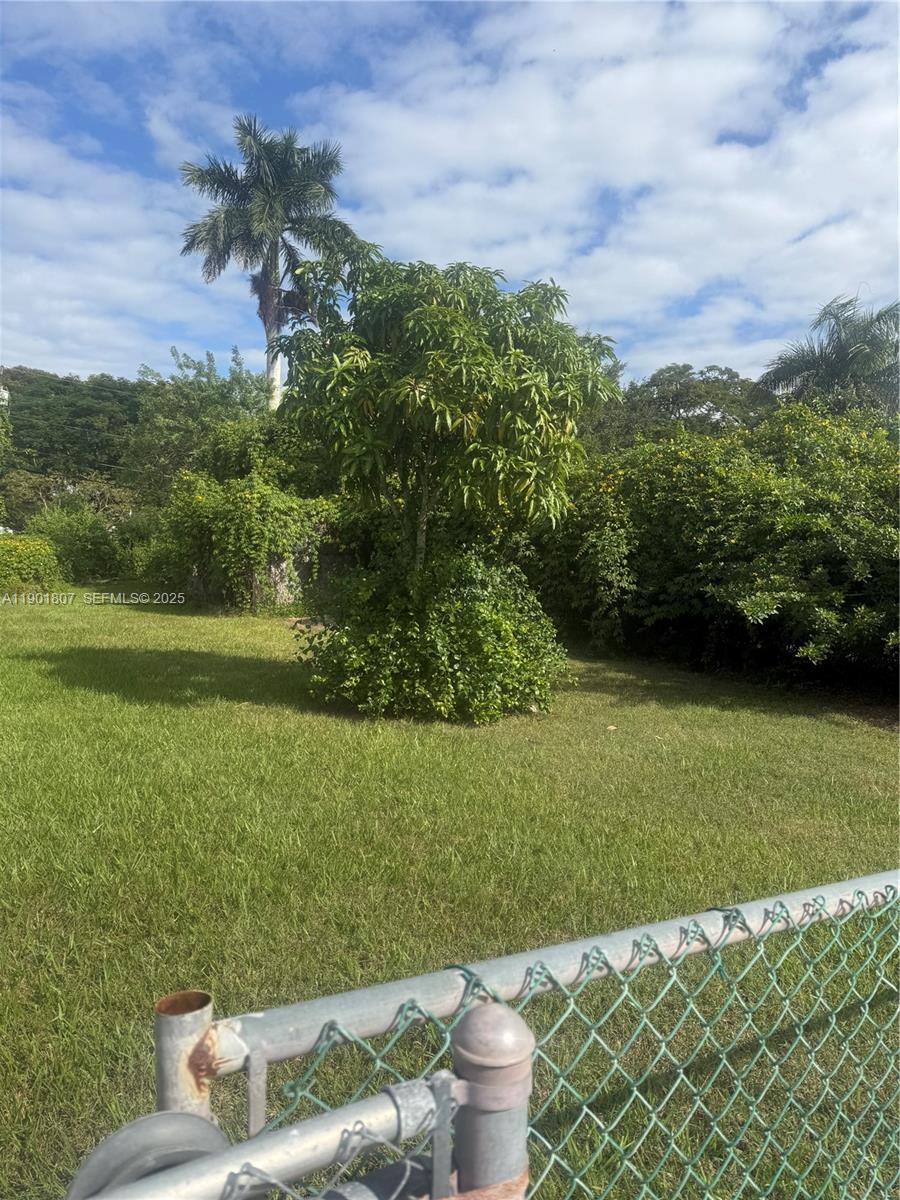 0 Northwest 19th Street Homestead, FL 33030 - Photo 3 of 5 a view of a backyard with plants and a garden