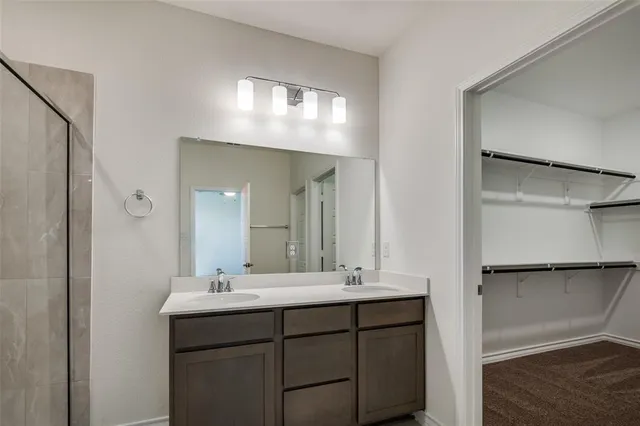 a kitchen with stainless steel appliances a refrigerator sink and microwave
