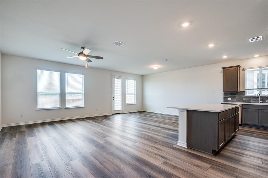 348 Fallbrook Drive Aledo, TX 76008 - Photo 28 of 31 a view of an empty room with wooden floor and a window