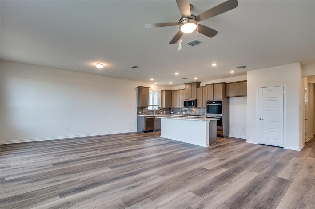 348 Fallbrook Drive Aledo, TX 76008 - Photo 29 of 31 a view of kitchen with granite countertop cabinets and refrigerator