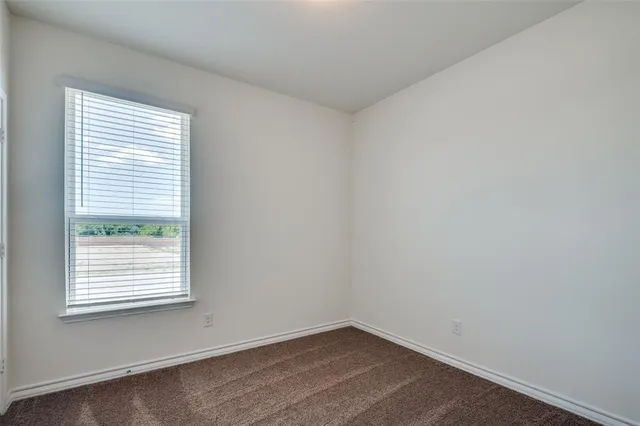 a large kitchen with stainless steel appliances granite countertop a stove a sink and a refrigerator