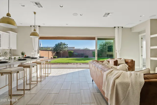 a view of a small space with wooden floor and a sink