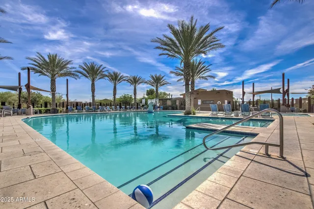 a room with lots of wooden furniture and paintings on the wall