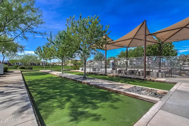 an aerial view of a houses and an outdoor space