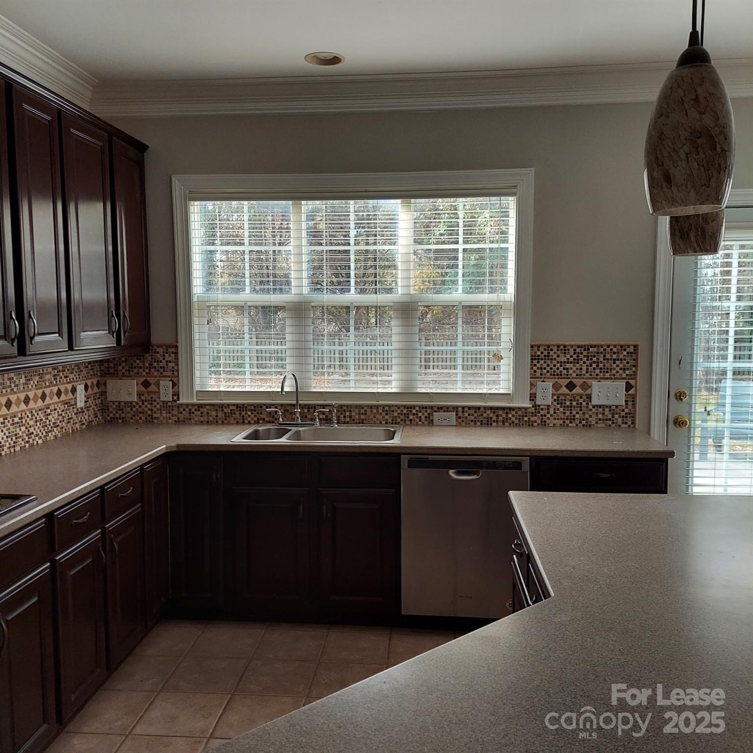 10820 Knight Castle Drive Charlotte, NC 28277 - Photo 11 of 35 a kitchen with a sink and large window