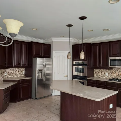 a view of empty room with windows