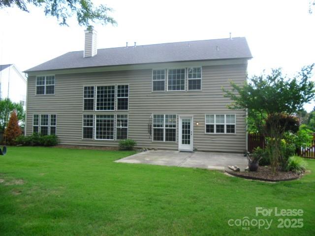 10820 Knight Castle Drive Charlotte, NC 28277 - Photo 35 of 35 a front view of a house with a garden and yard