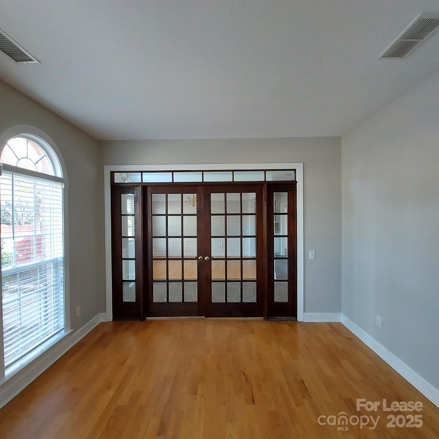 10820 Knight Castle Drive Charlotte, NC 28277 - Photo 4 of 35 an empty room with windows