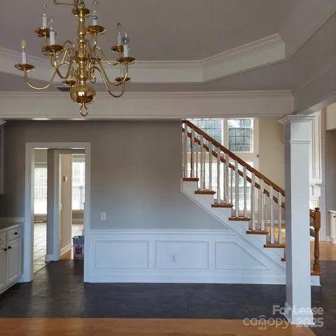 a living room with stainless steel appliances kitchen island granite countertop a living room view