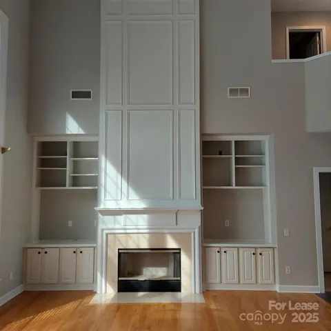 a kitchen with stainless steel appliances granite countertop a sink a stove and a microwave