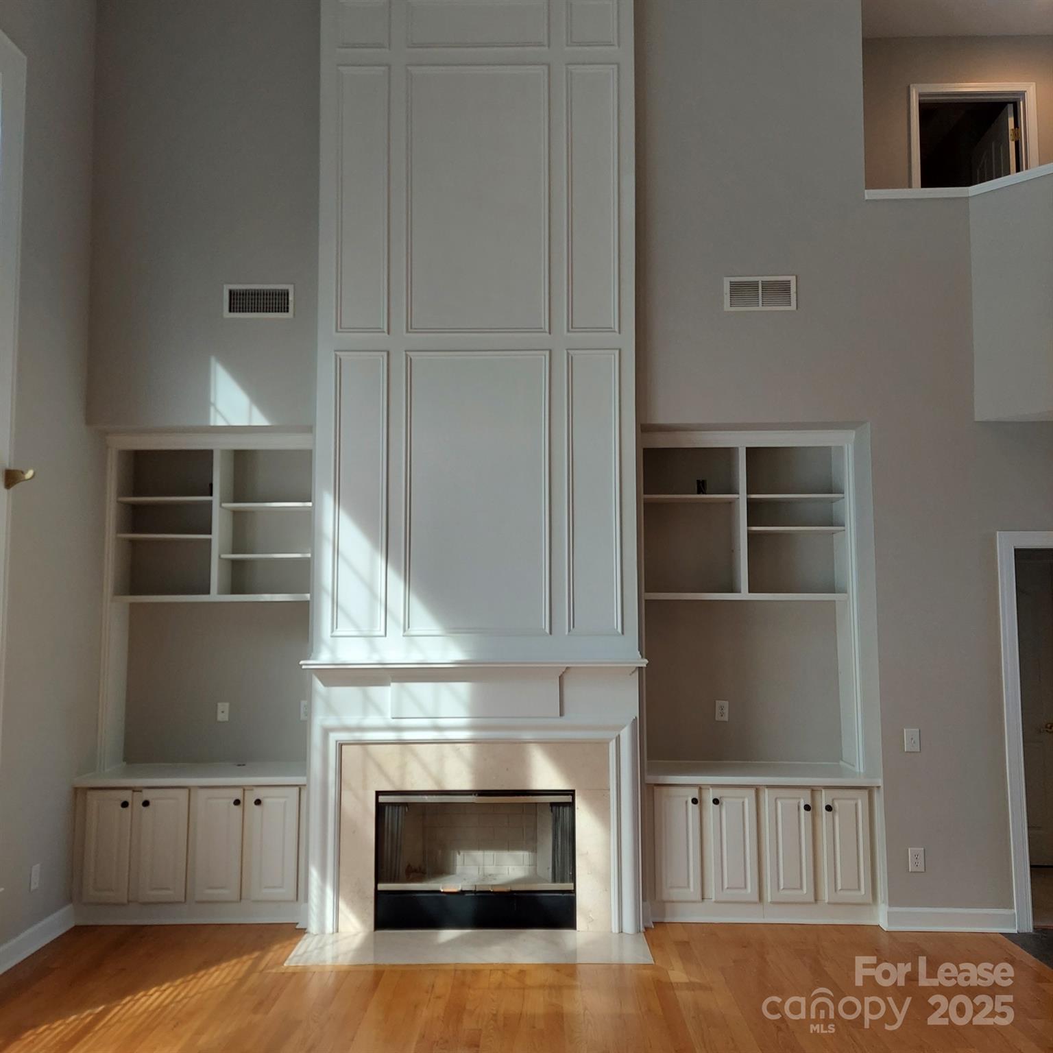 10820 Knight Castle Drive Charlotte, NC 28277 - Photo 8 of 35 a view of a livingroom with wooden floor and staircase
