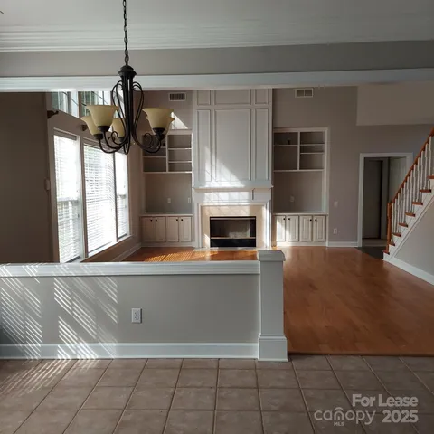 a kitchen with a sink and large window