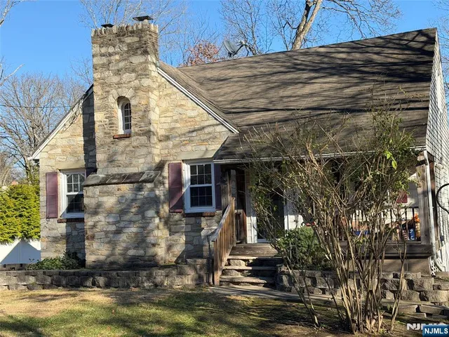 a aerial view of a house with a yard