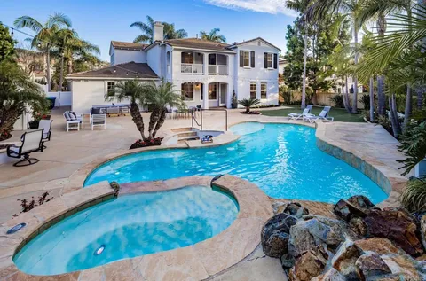 a view of a swimming pool with a patio