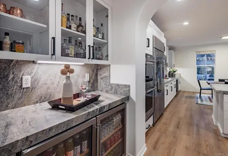 a kitchen with stainless steel appliances granite countertop a stove and a refrigerator