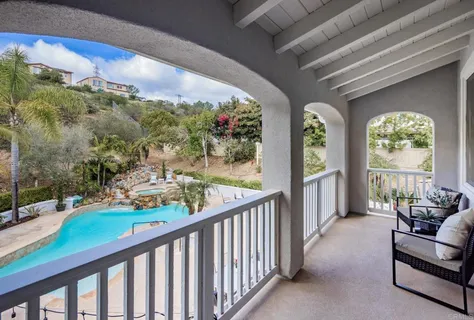a view of a porch and garden