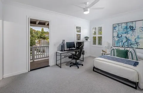 a bedroom with bed and a window