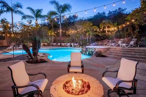 a view of a backyard with sitting area