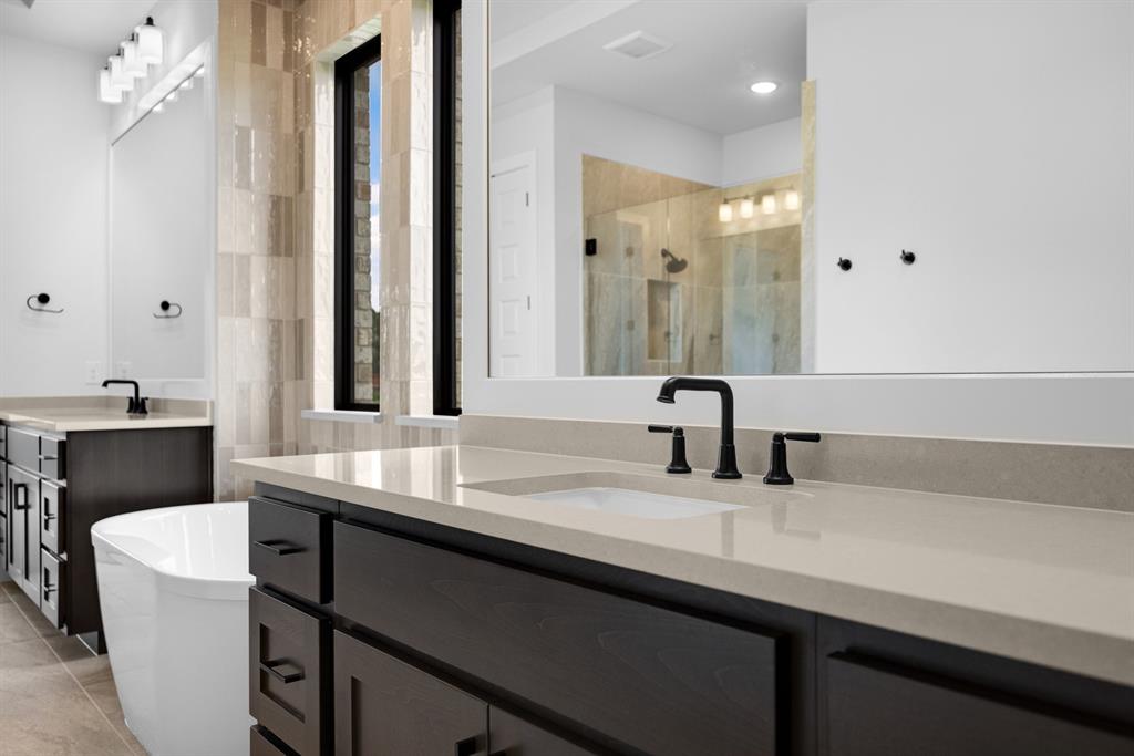 207 Links Court Heath, TX 75126 - Photo 18 of 39 a bathroom with a sink and a mirror