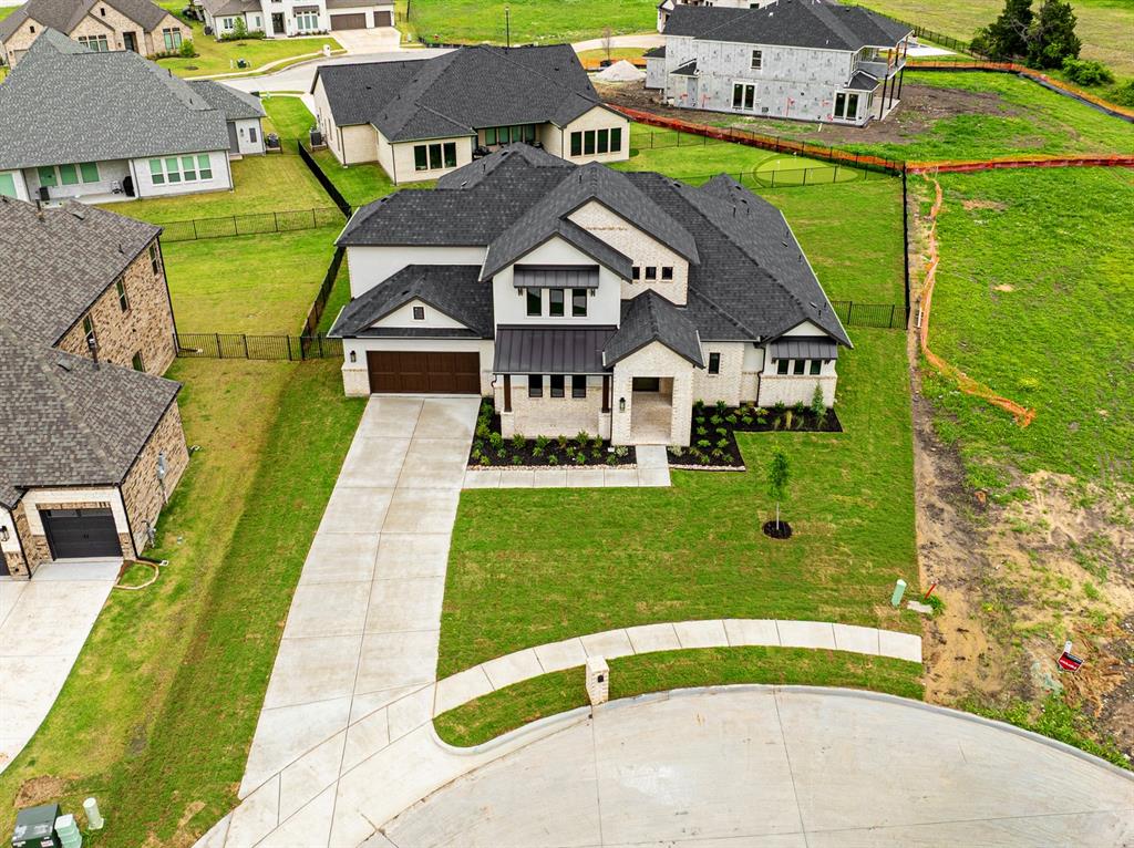 207 Links Court Heath, TX 75126 - Photo 2 of 39 a aerial view of a house with a garden