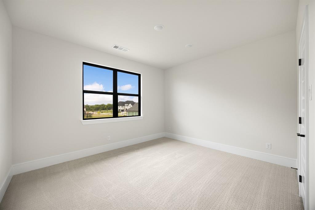 207 Links Court Heath, TX 75126 - Photo 26 of 39 an empty room with windows