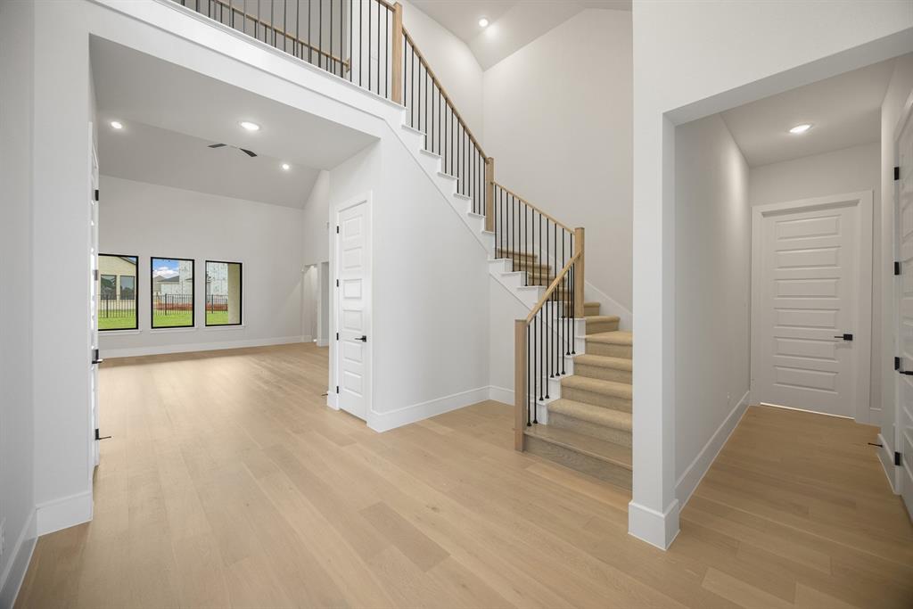 207 Links Court Heath, TX 75126 - Photo 3 of 39 a view of entryway with stairs and wooden floor