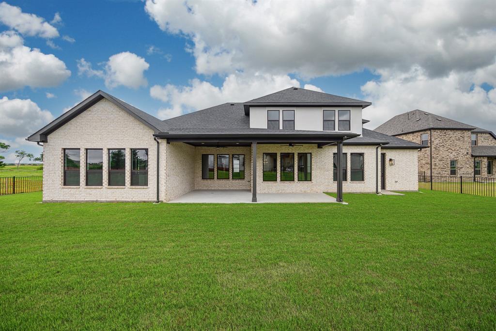 207 Links Court Heath, TX 75126 - Photo 36 of 39 a front view of a house with a garden