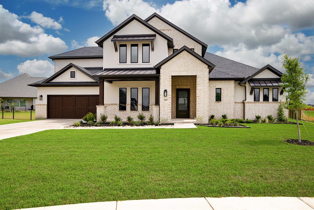 207 Links Court Heath, TX 75126 - Photo 39 of 39 a front view of a house with a garden and yard
