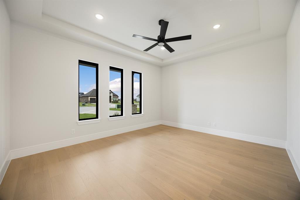 207 Links Court Heath, TX 75126 - Photo 4 of 39 a view of a livingroom with a ceiling fan and window