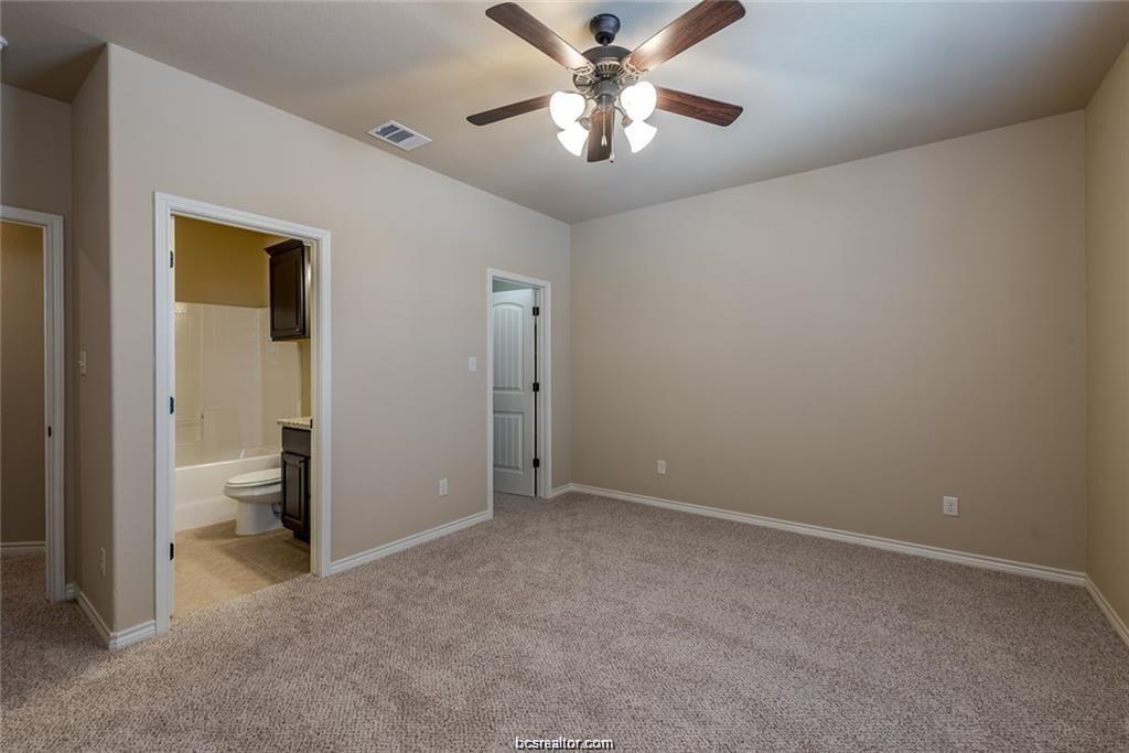 4303 Commando Trail College Station, TX 77845 - Photo 6 of 12 wooden floor in an empty room and a bathroom
