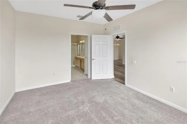 a bathroom with a granite countertop sink a mirror and a shower