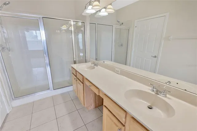 a white toilet sitting next to a white wall