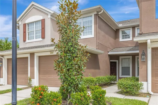 front view of a house with a garden