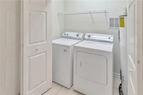 a view of a room that has a bed