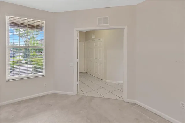 a bathroom with a shower and a glass door