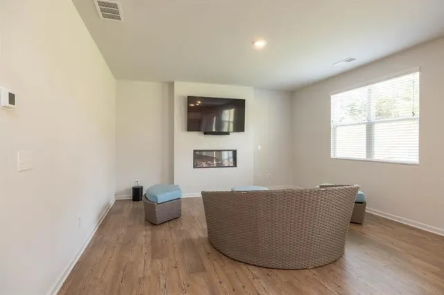 a living room with a couch and a window