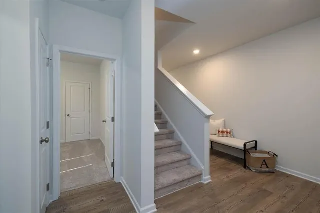 a view of entryway with wooden floor and stairs