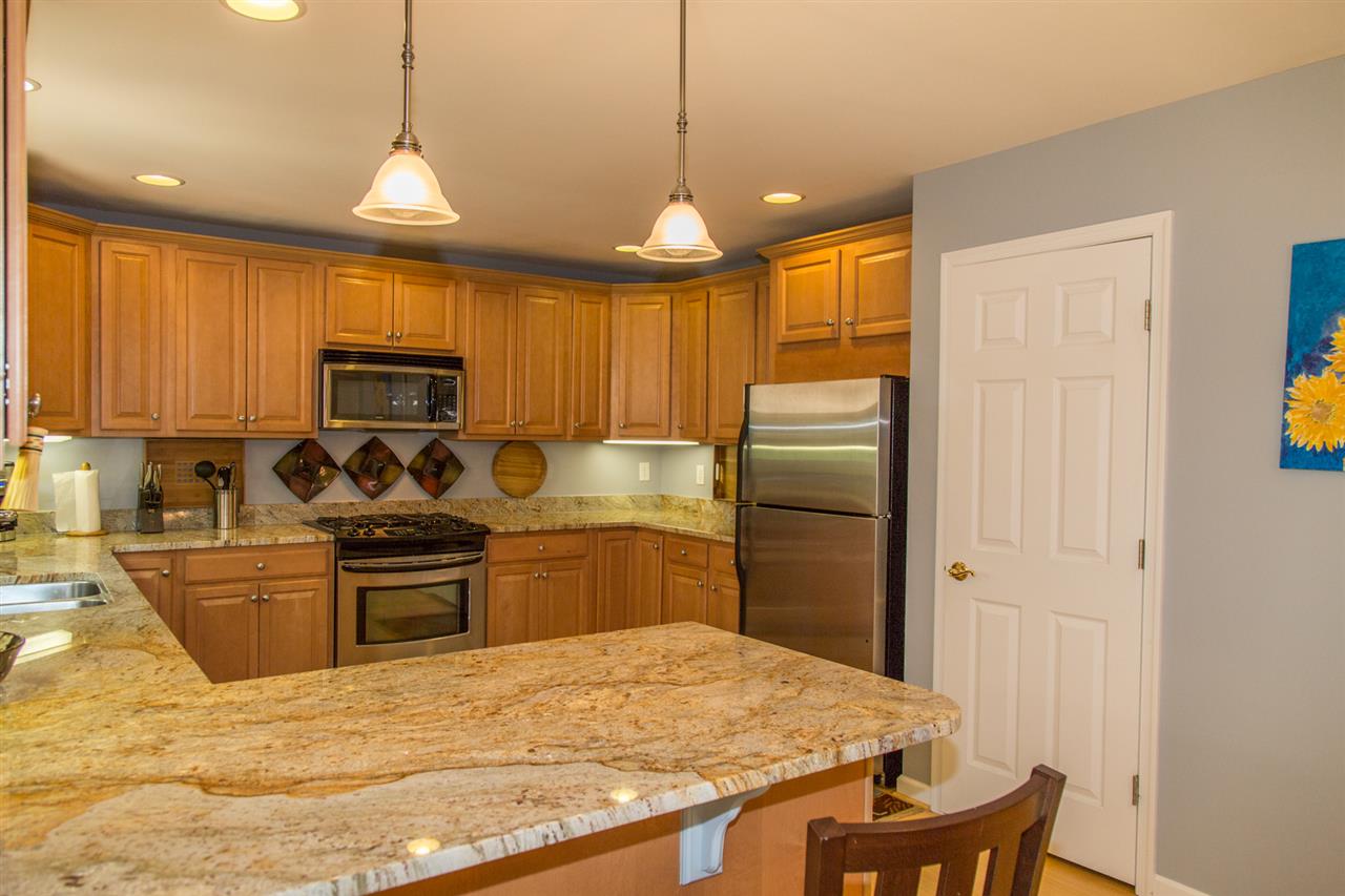 50 Oak Grove Road Palmyra, VA 22963 - Photo 28 of 50 a kitchen with granite countertop a refrigerator stove top oven and sink