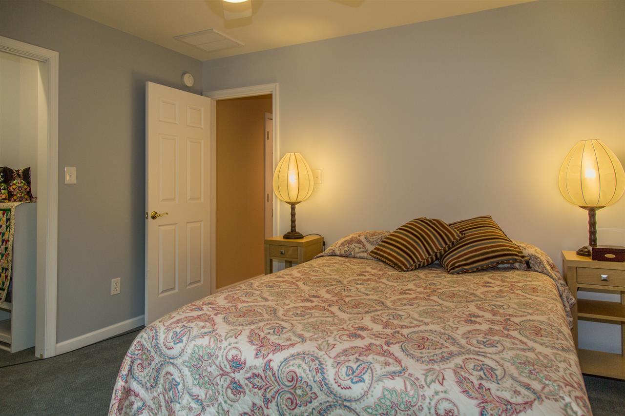 50 Oak Grove Road Palmyra, VA 22963 - Photo 39 of 50 a bedroom with a bed and a lamp
