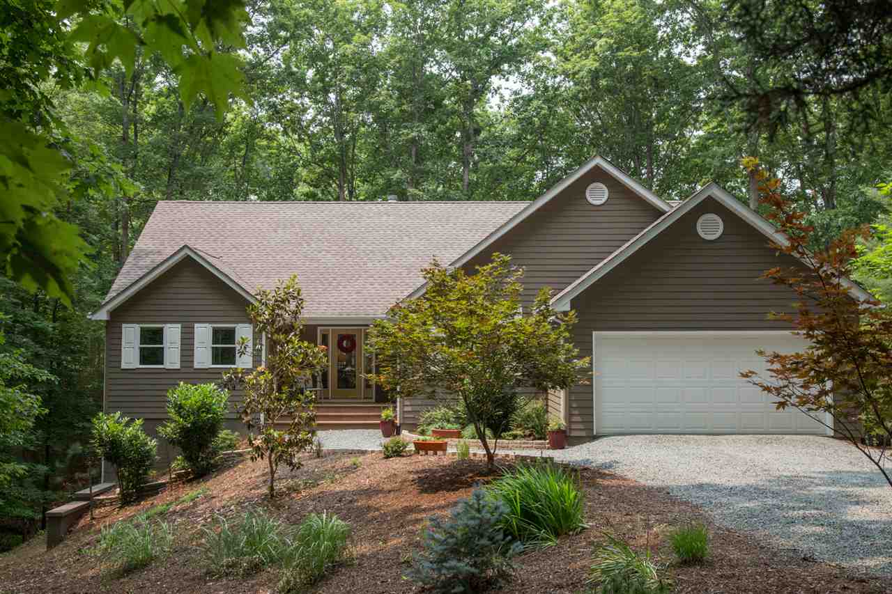 50 Oak Grove Road Palmyra, VA 22963 - Photo 5 of 50 a front view of a house with a garden and plants