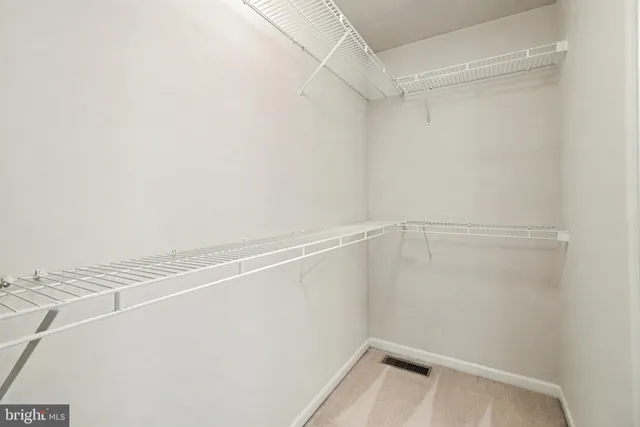 a view of a room with racks on the wall