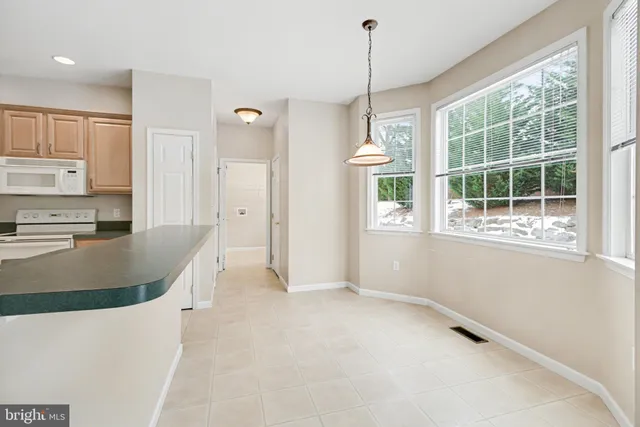 a view of a kitchen with a window