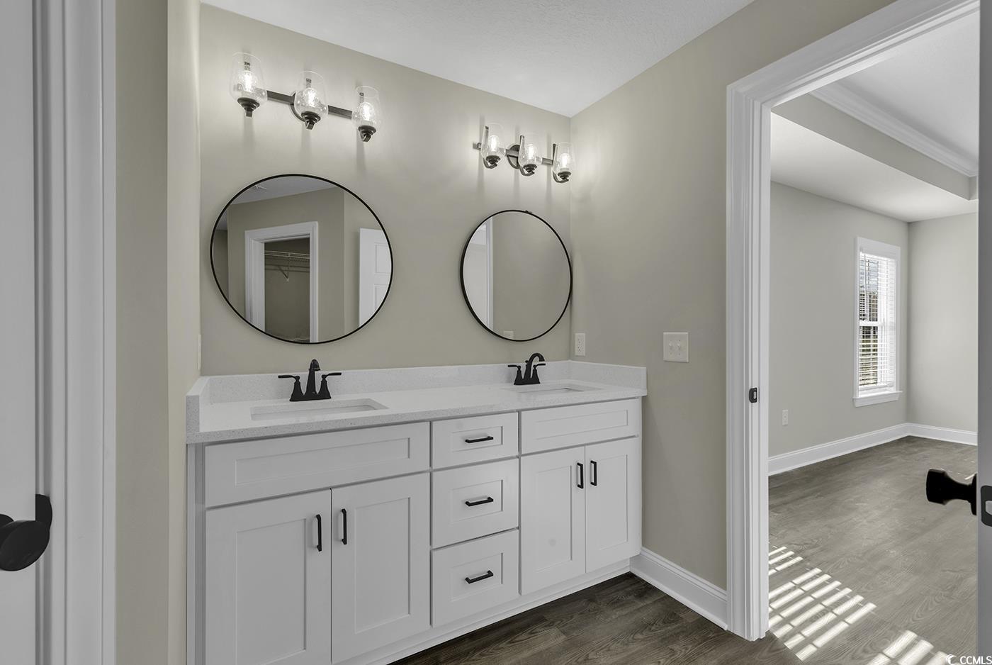 3255 Red Bluff Road Loris, SC 29569 - Photo 38 of 38 Full bathroom featuring double vanity and dark wood-style floors