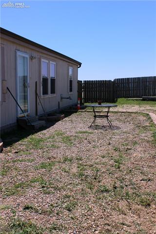 16135 Stage Stop Road Peyton, CO 80831 - Photo 17 of 25 Front yard